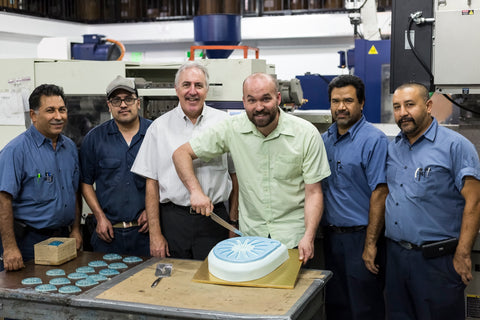 Matthew Michel, inventor of Whisk Wiper, celebrating the start of the first round of production with the crew of C&G Mercury Plastics.