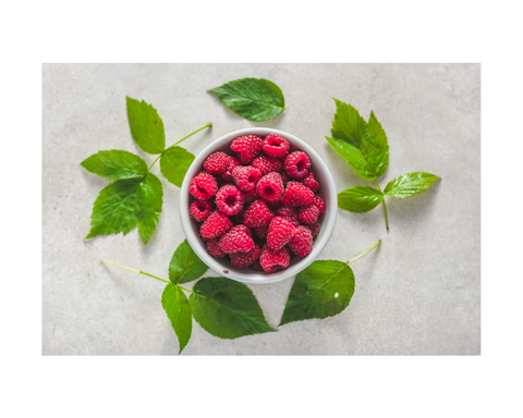 raspberries surrounded by leaves