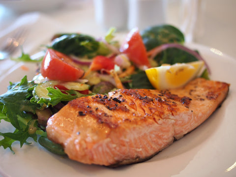 clean eating - cooked salmon on ceramic plate