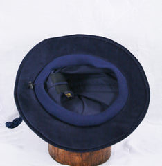 The inside of a wizard hat featuring the stretch band.
