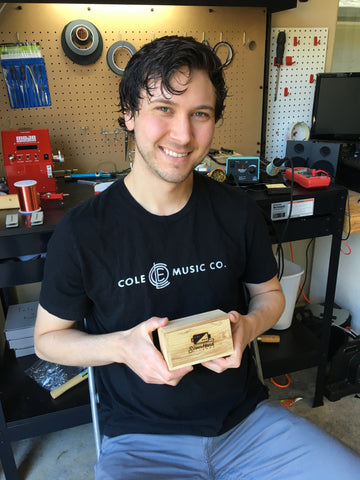 Brad Perry holding electric guitar pickup box