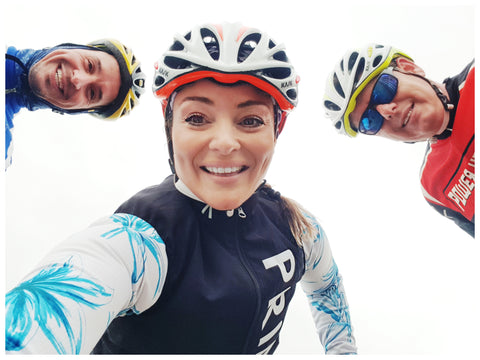 Rachael with two friends riding their bikes