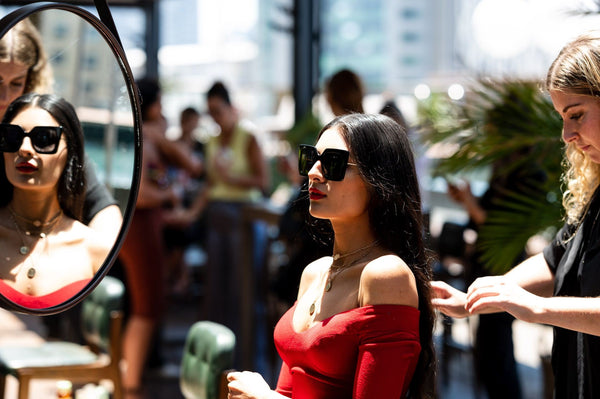 Girl having hair styled with foretasted hair & beauty trends at Oz Hair event.