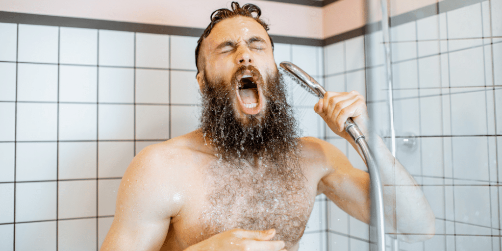 Man Showering with Cold Water