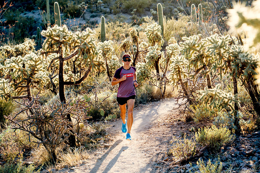 Lisa Roberts running through the Tuscon, Arizona dessert.