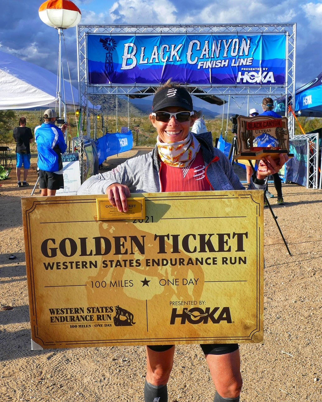 Lisa Roberts holding the Western States golden ticket after taking second at Aravaipa Running Black Canyon Ultras, Black Canyon, AZ