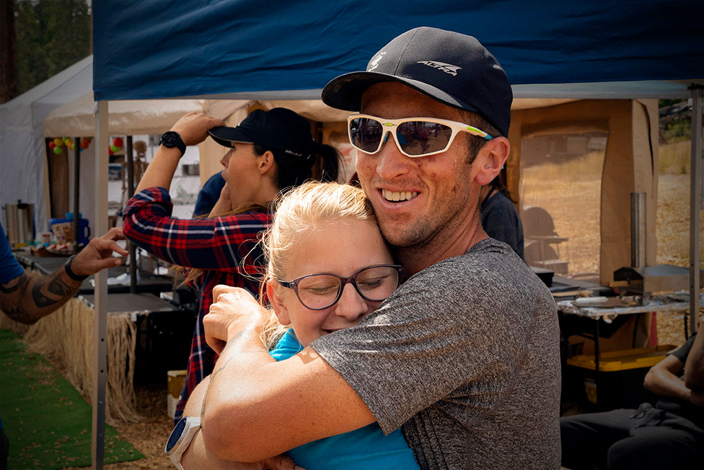 Michael McKnight hugging his crew (wife Sarah) after finishing the Tahoe 200 mile ultramarathon