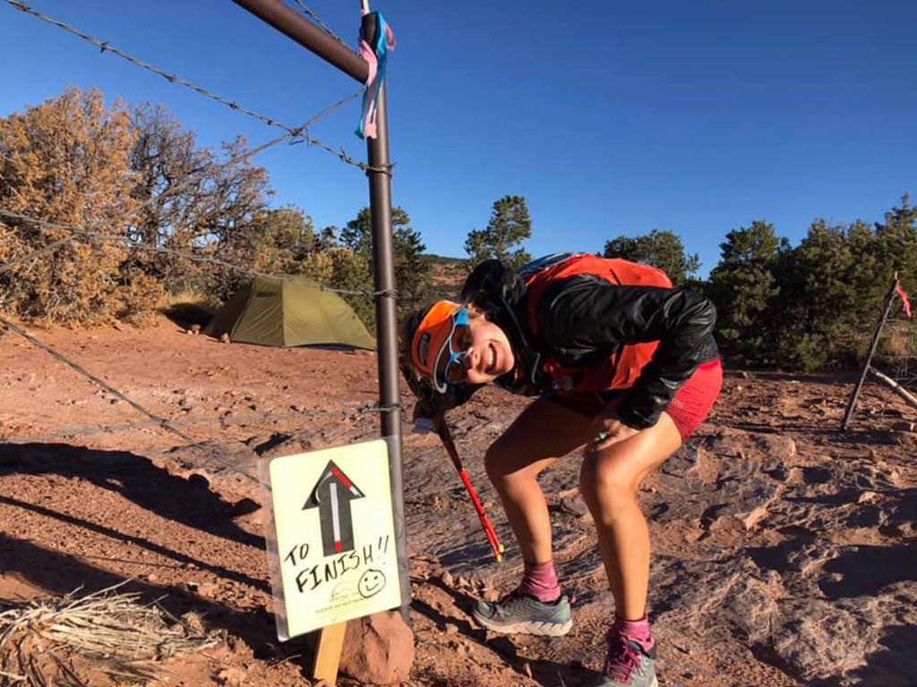 Jessi Morton-Langehaug managing a big smile at porcupine rim even though she has very painful feet