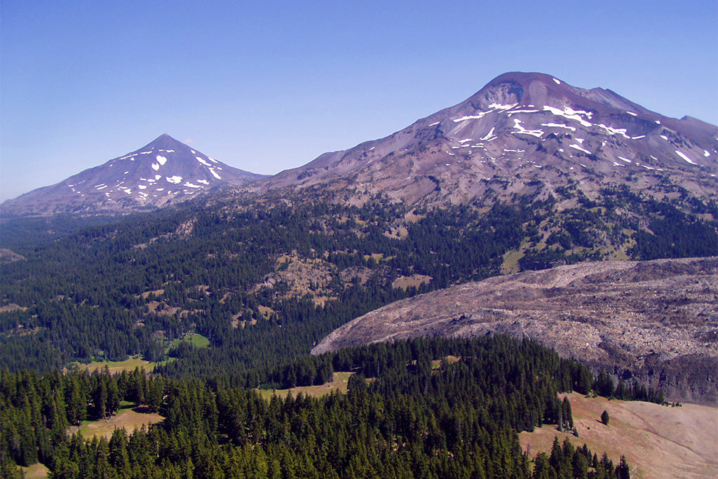 The Cascade 100 runs by the Three Sisters Wilderness with the Middle Sister and South Sister shown here