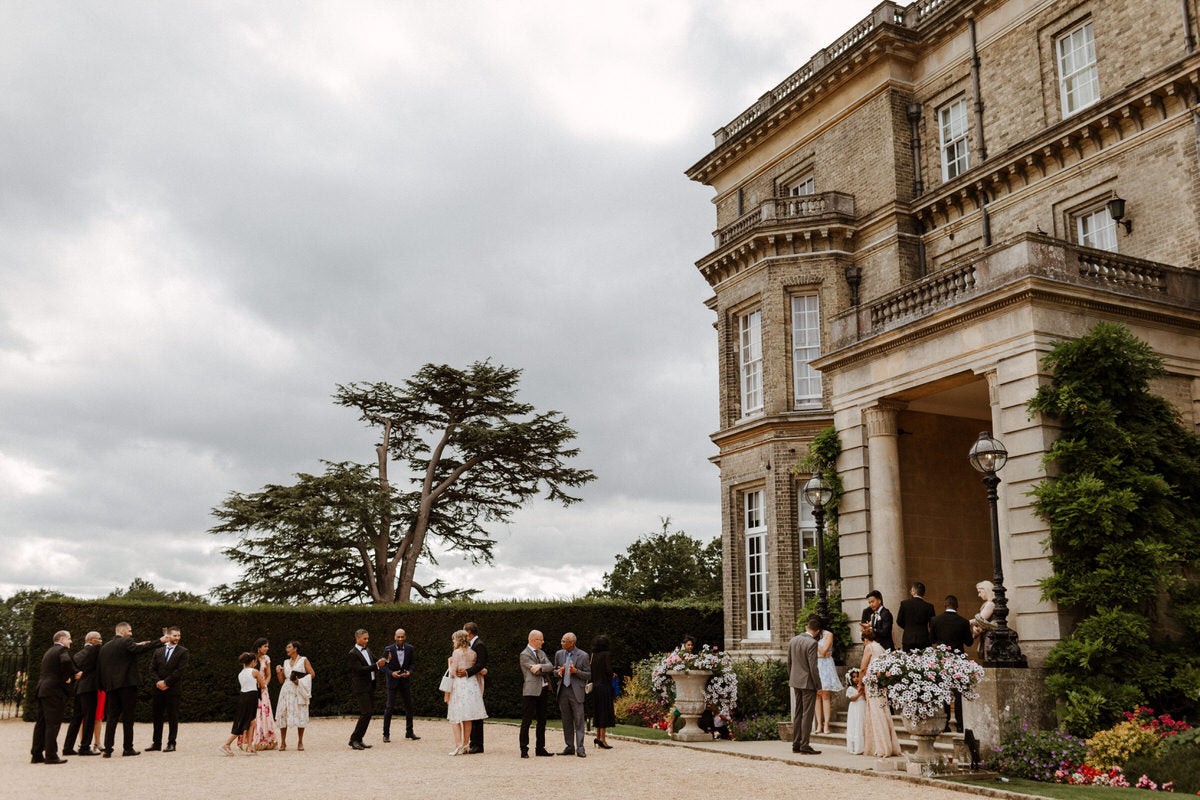 Guests and bridal party arrive at Hedsor house for the wedding reception.