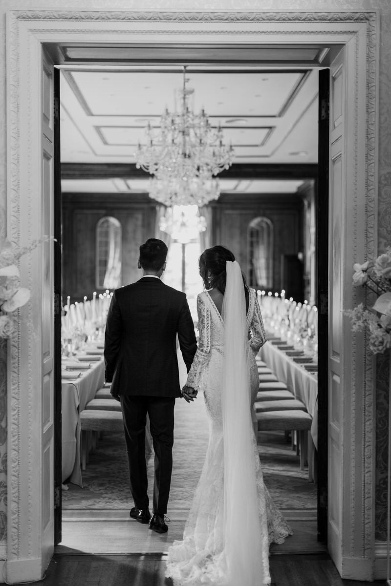 Groom Patrick and Bride Charlotte enter their reception venue, Hedsor House.