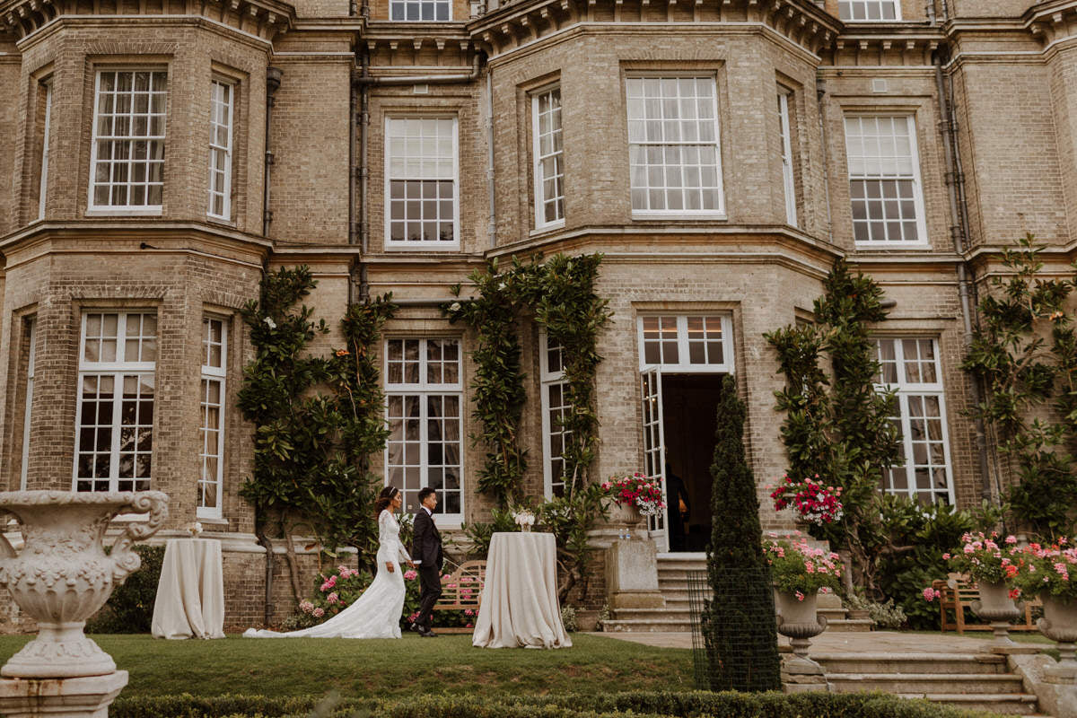 Bride and groom outside their reception venue, Hedsor House.