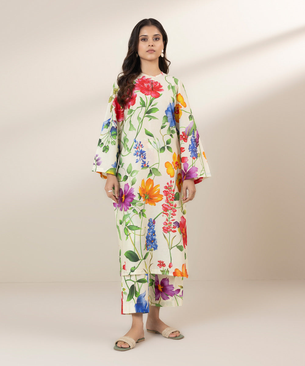 Off-white trouser design and shirt design, decorated with colourful florals.