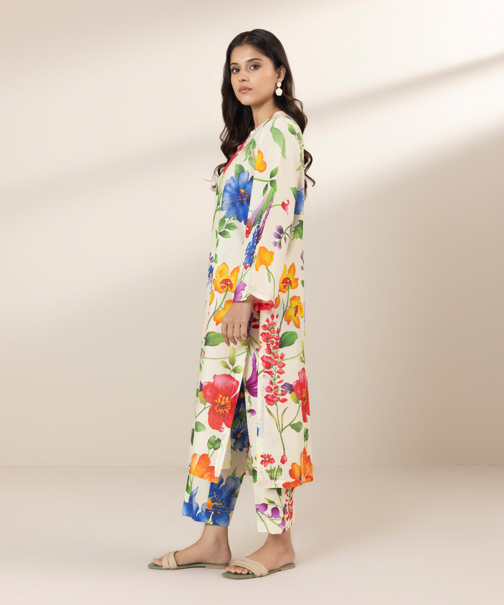 Off-white trouser design and shirt design, decorated with colourful florals.