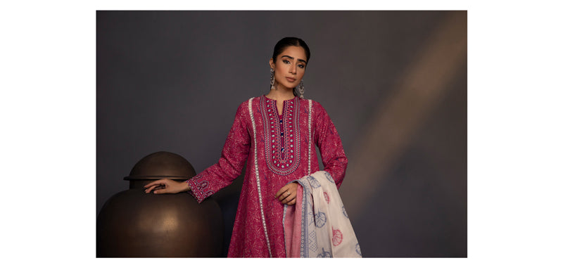 Girl standing in pink kurta shalwar