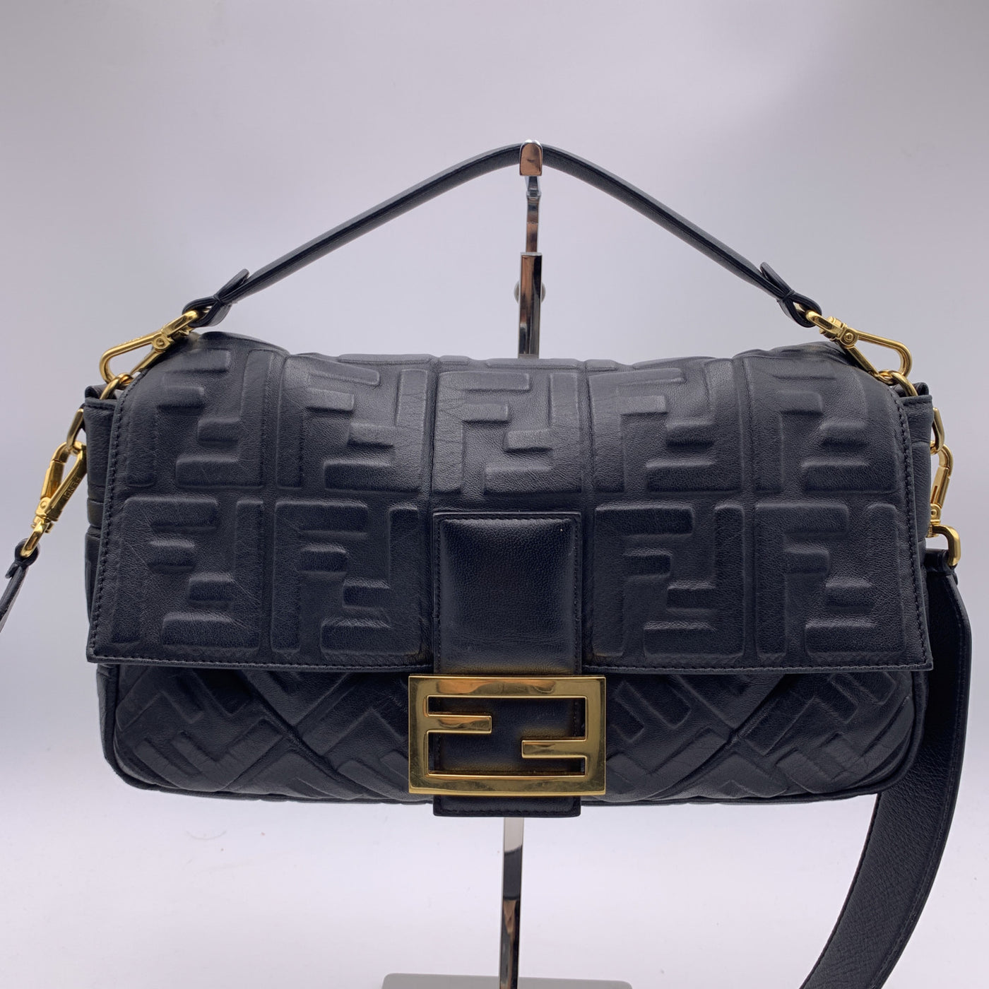 fendi baguette embossed leather clutch