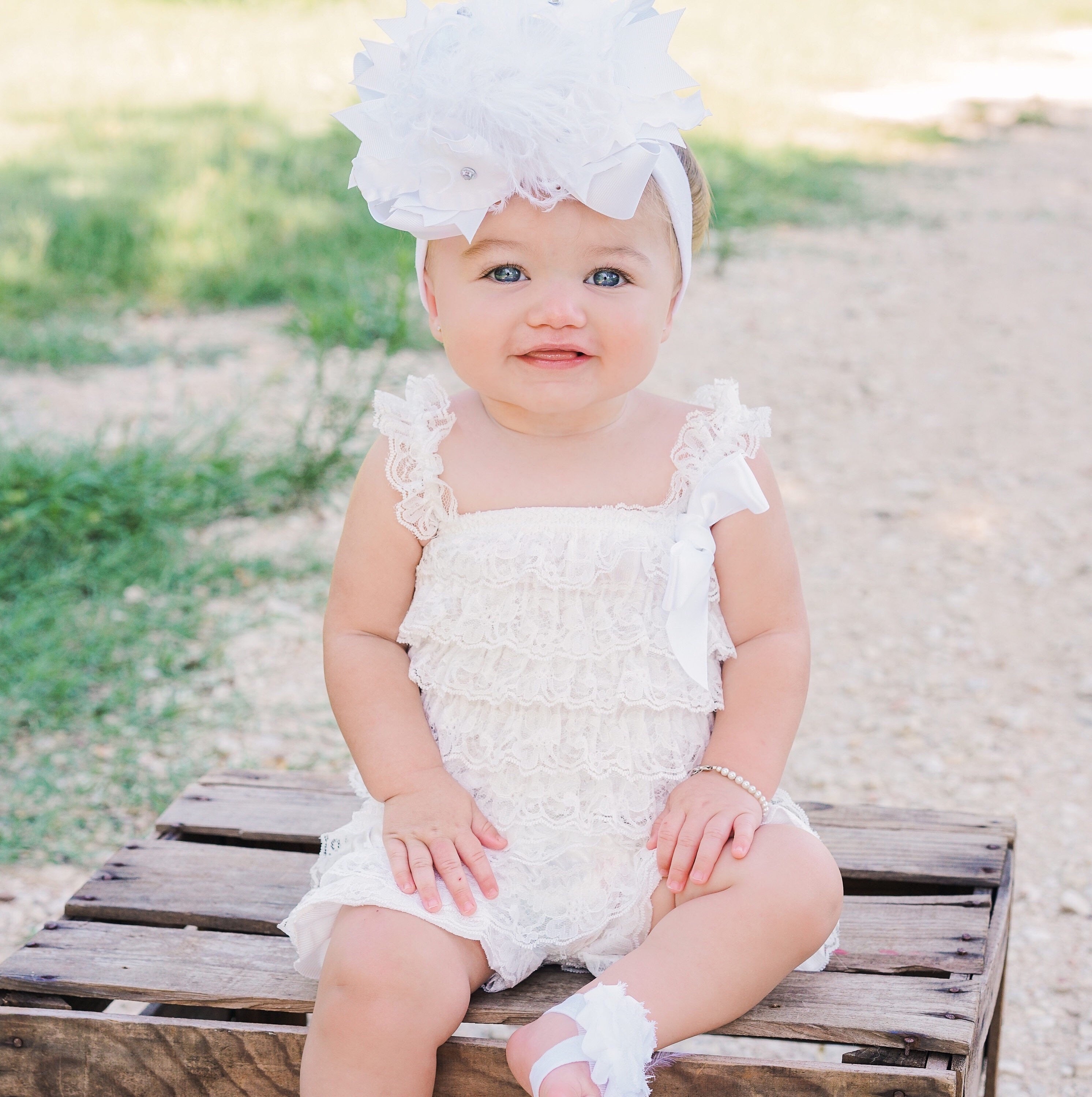 baby in white dress
