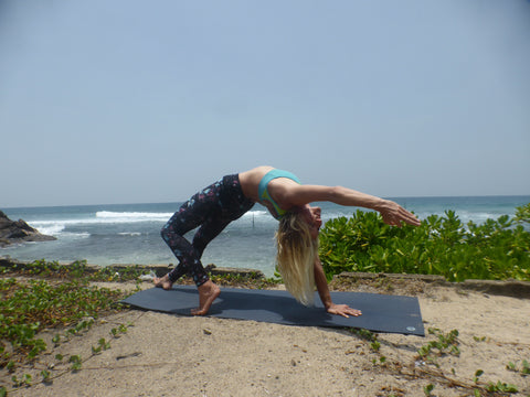 Nat practising beachside yoga 