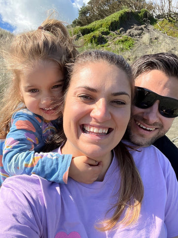 Carlie with daughter Mila and husband Dimitri