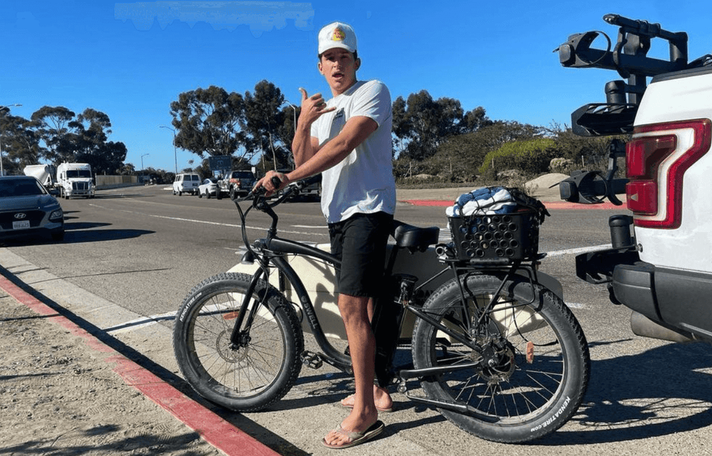 surfer dude riding electric bike