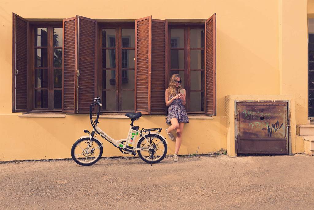 girl outside building with city premium folding ebike