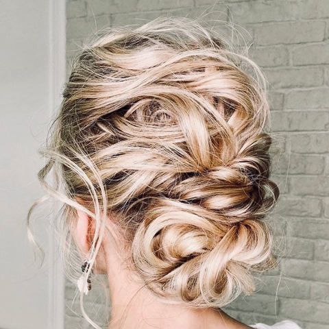 back view of woman's head with textured bun