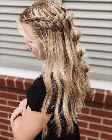 side view of woman with half up half down bubble braid