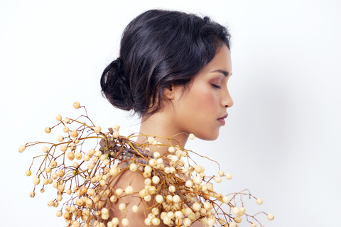 side view of woman's head in beautiful bun