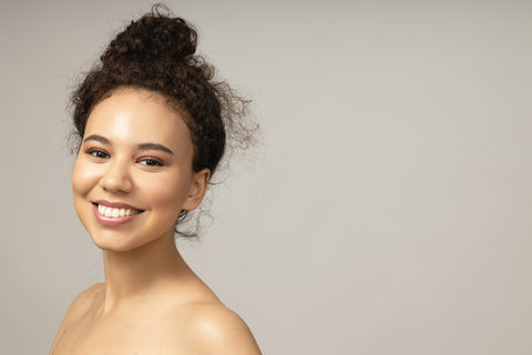 beautiful woman with curly bun