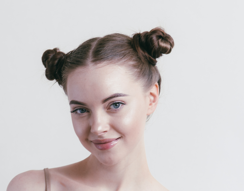 beautiful woman with space buns