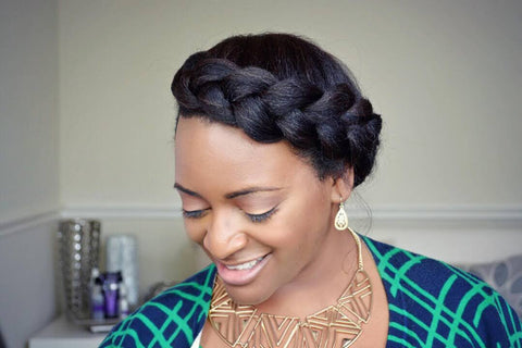 black woman smiling with crown braid