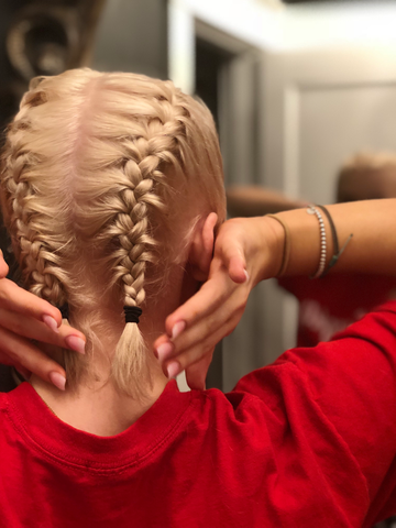 girl with blonde hair with french braids