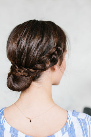 woman with braided low bun