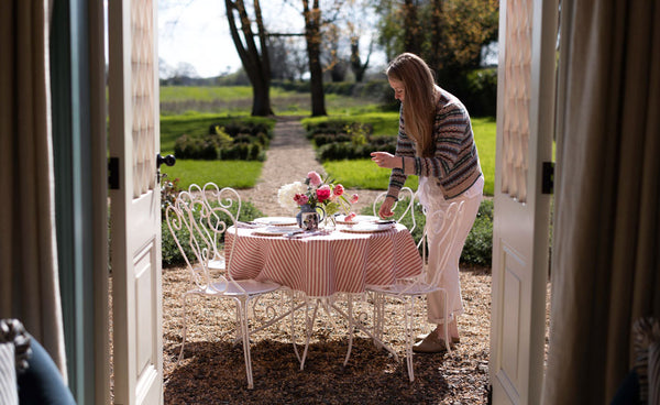 Photo of Faye laying the table for the shoot