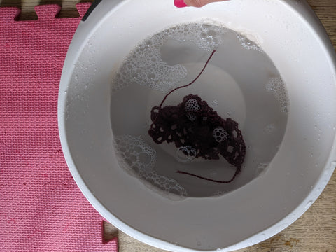 swatch soaking in a bowl of water