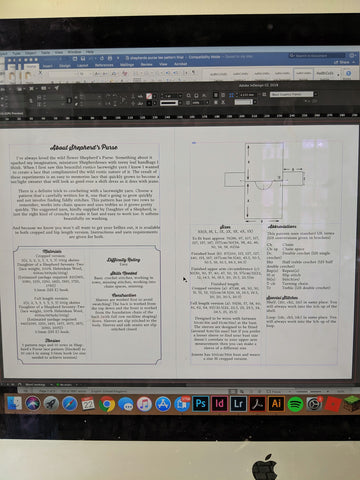 a computer screen shows a page view of a new crochet pattern in Indesign