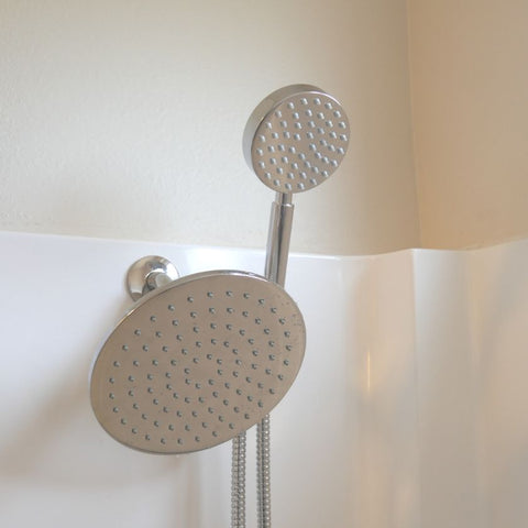 The best dual shower head is shown in a white and tan shower