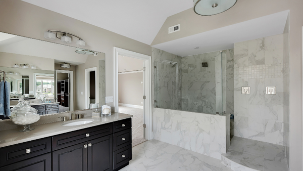 A walk in doorless shower in a modern bathroom