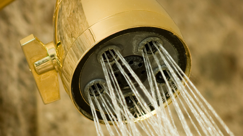 gold shower head spraying water