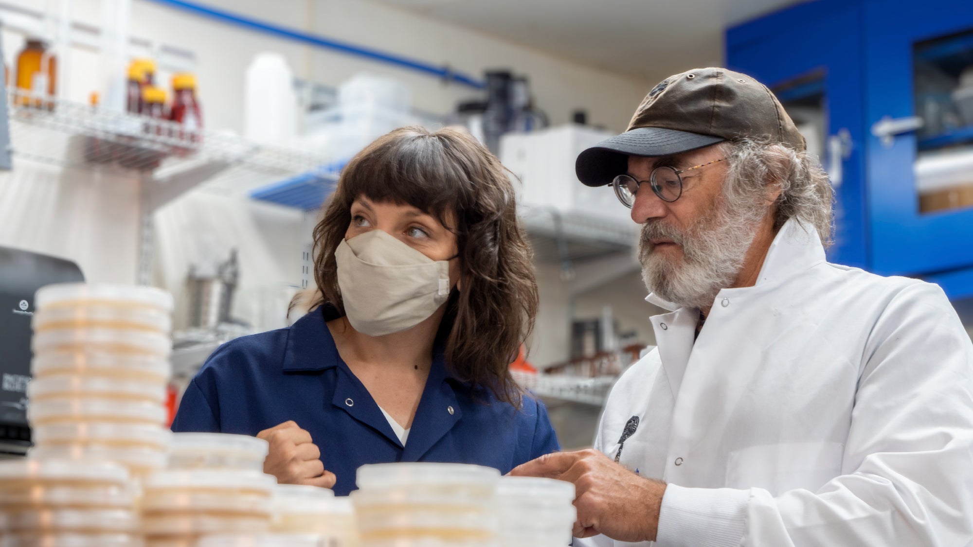 Paul Stamets and Renee Davis, MA in the lab looking at petri dishes