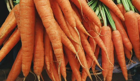 a bunch of vibrant colored carrots