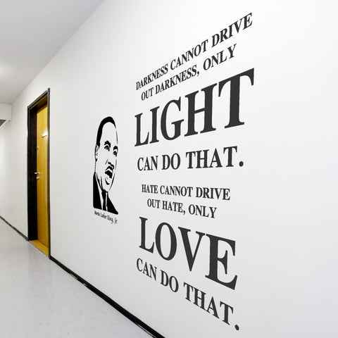 A large Simple Stencil wall display on a school hallway wall to inspire students during Black History Month reads: “Darkness cannot drive out darkness; only light can do that. Hate cannot drive out hate; only love can do that.” Martin Luther King, Jr.