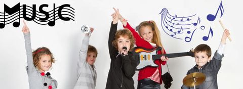 Diverse group of students laugh and play instruments in a music room adorned with colorful music notes and instrument decals, creating a vibrant and inspiring learning environment.