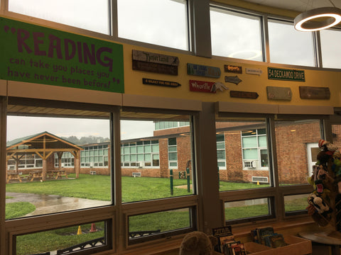 Custom Library Wall Display created by a customer using Simple Stencil decals. She applied the decals to various colored and sized signs for display over a large window in her school library. 
