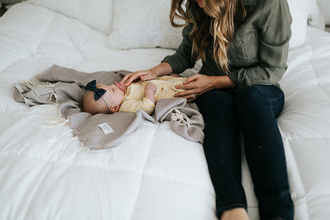 baby in a soft turkish towel while traveling