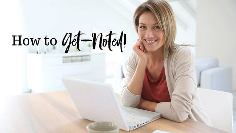 woman designing notepad on laptop