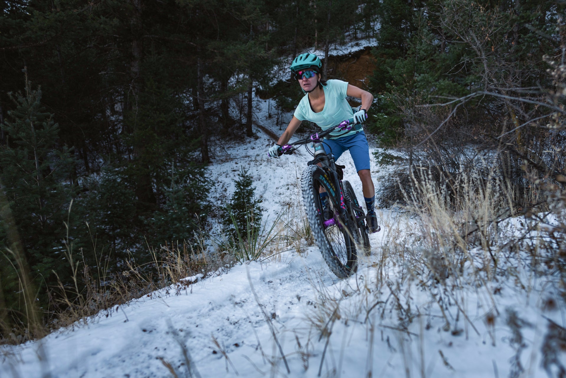 Snow meets singletrack on the Ute Pass Trail, where the author traces a line through the ponderosa pine forest. It’s a reminder that the lines—both seen and invisible—on maps today are actually ancient trails or routes long traversed by Indigenous peoples. Photo: Leonardo Brasil