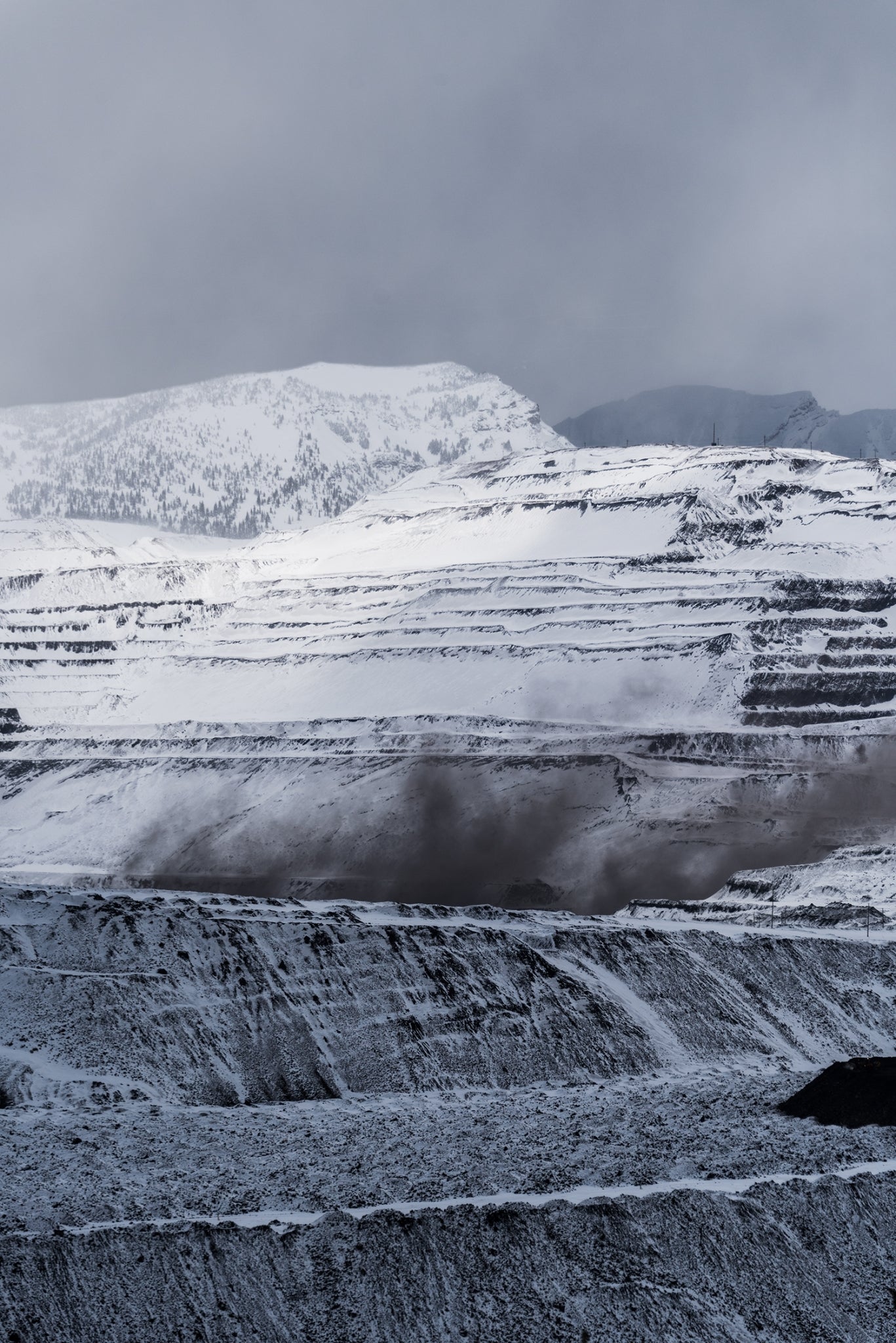 Terra firma incognita. Coal dust rises from a midday blast at Teck’s Fording River mine, where the overburden (mining slang for “mountain”) is being manipulated to access buried coal seams hundreds of feet below the surface. Photo: Kari Medig.