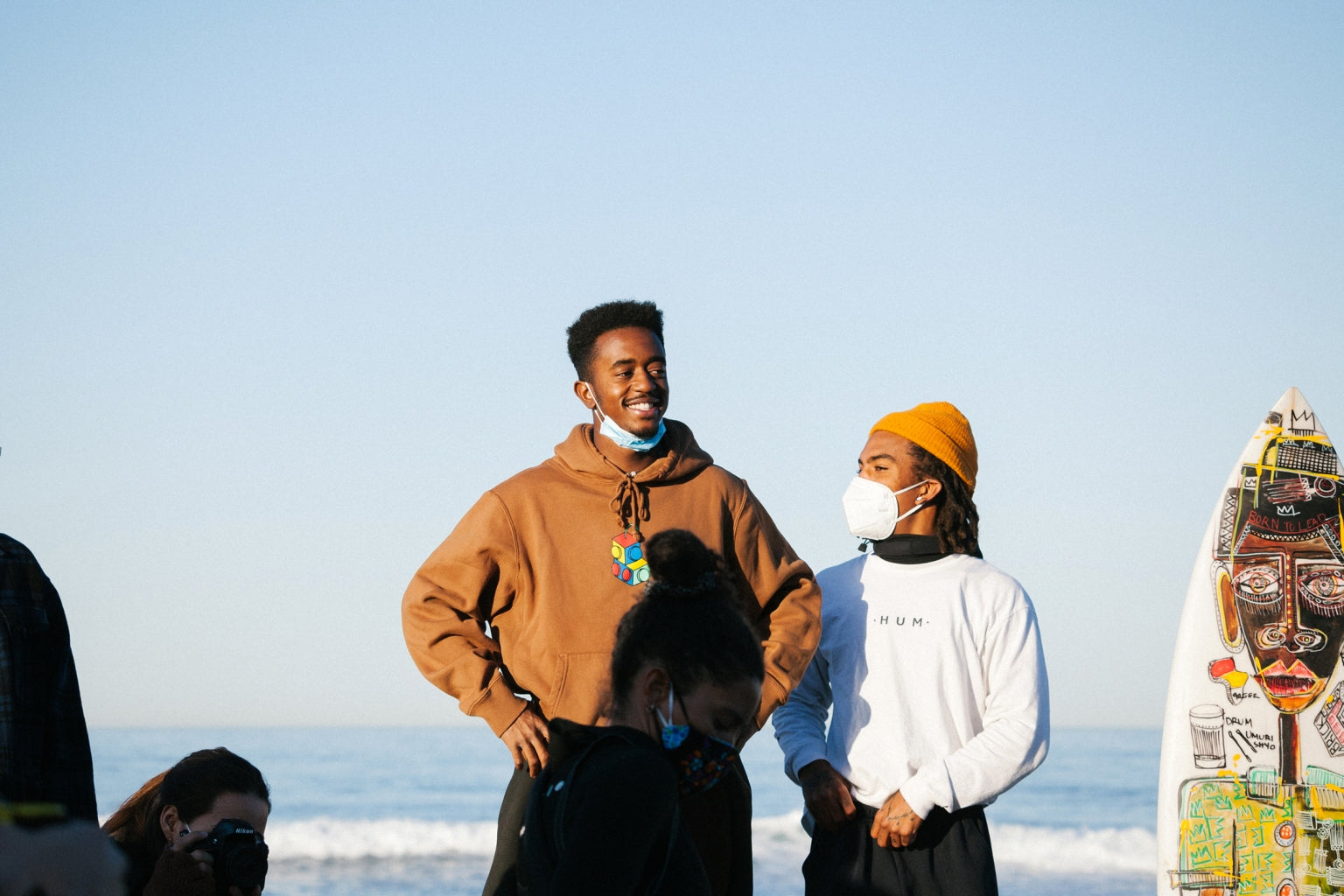 Brick and Gage Crismond admire the turnout of Black surfers and their allies during Black Sand’s Peace Paddle on February 21, 2021.