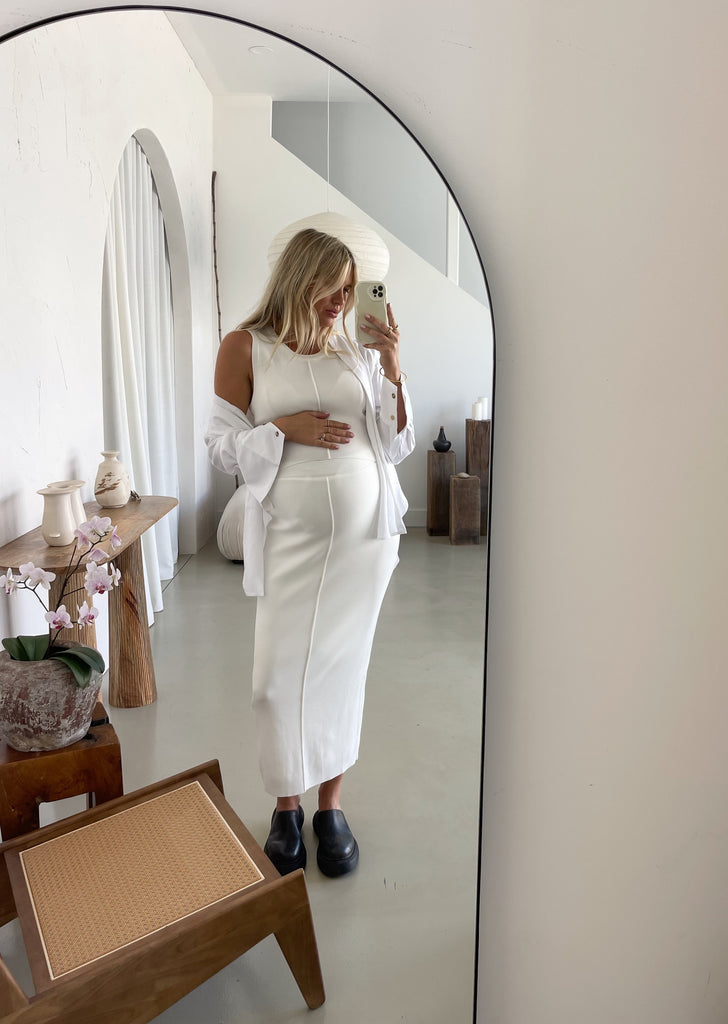 Pregnant Woman in White Maternity Top and Skirt with White Maternity Shirt over the top